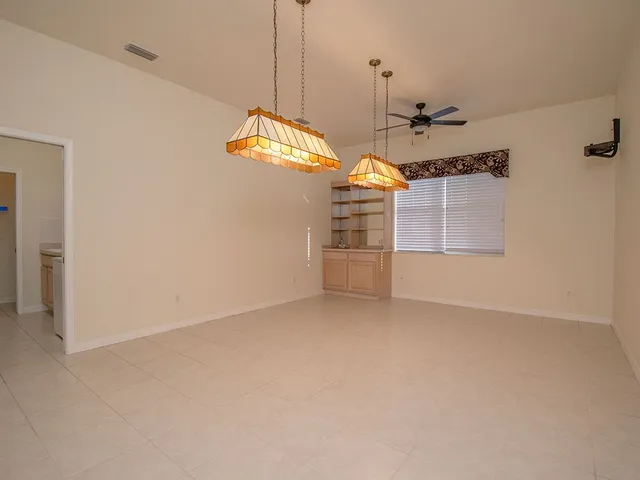 a view of a house next to a big yard