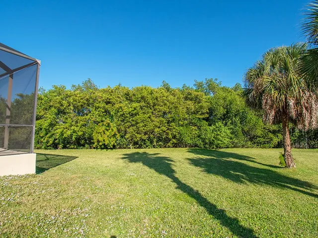 a view of a swimming pool with a lounge chairs