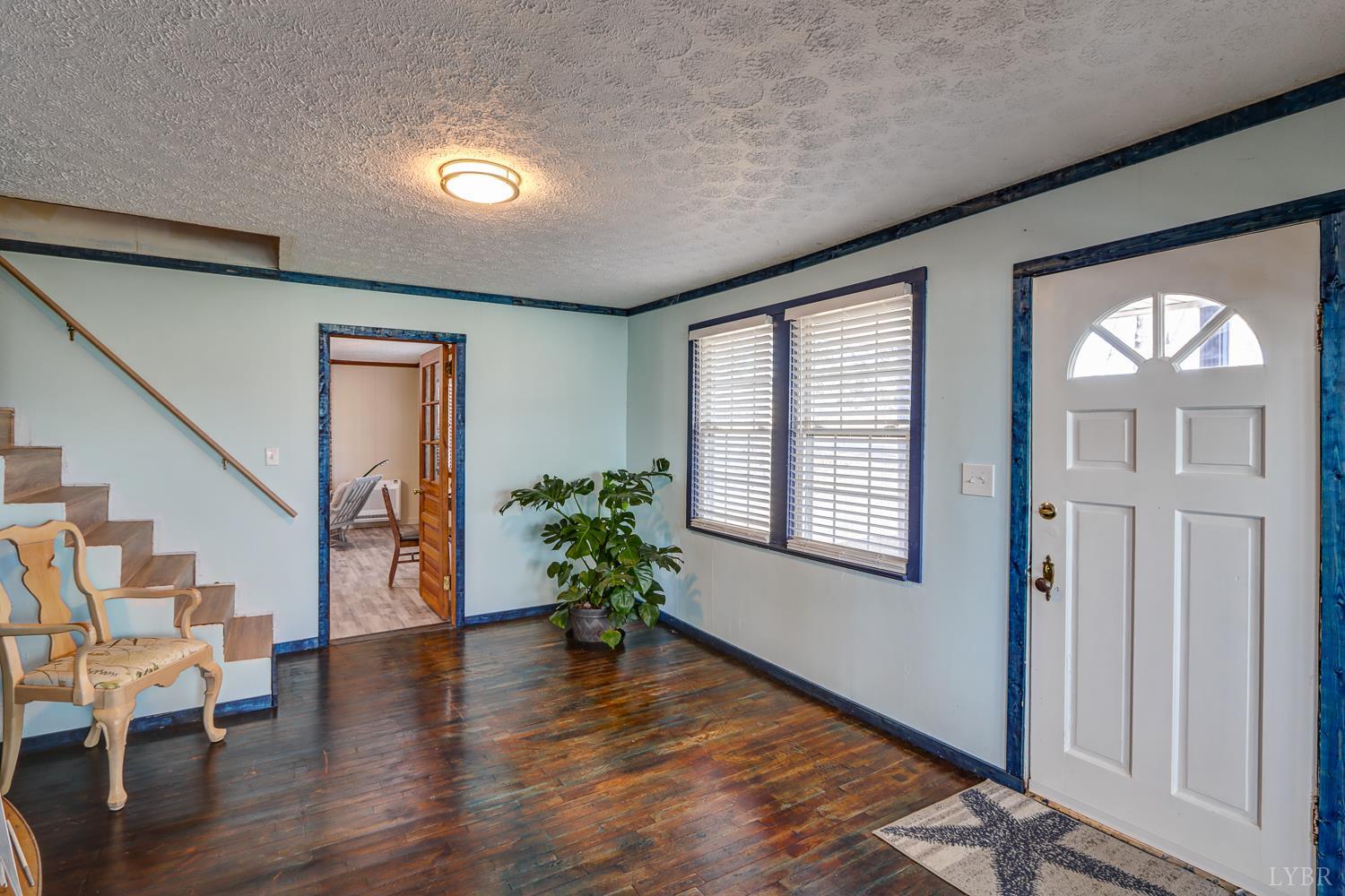 3292 Payneton Road Chatham, VA 24531 - Photo 13 of 48 a view of an entryway with wooden floor and windows