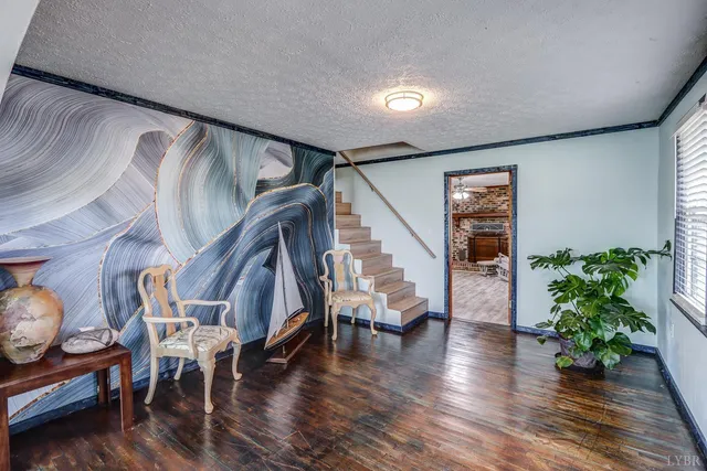 a view of entryway with livingroom and wooden floor