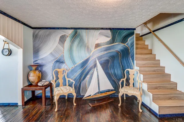 a view of entryway with wooden floor