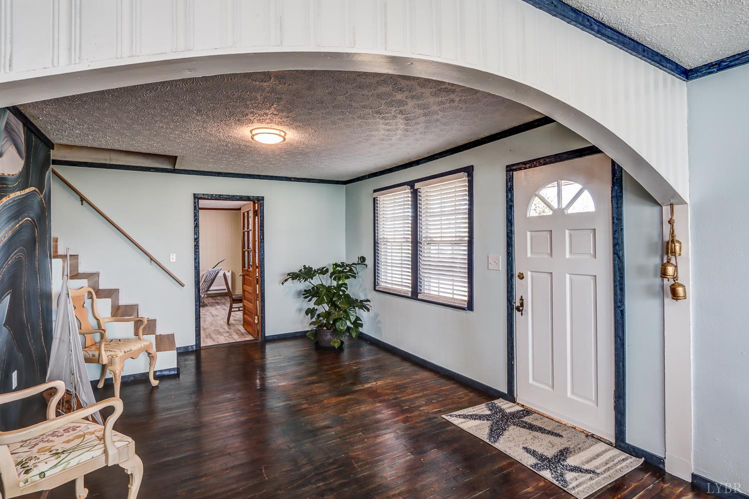3292 Payneton Road Chatham, VA 24531 - Photo 21 of 48 a hallway with wooden floor and windows