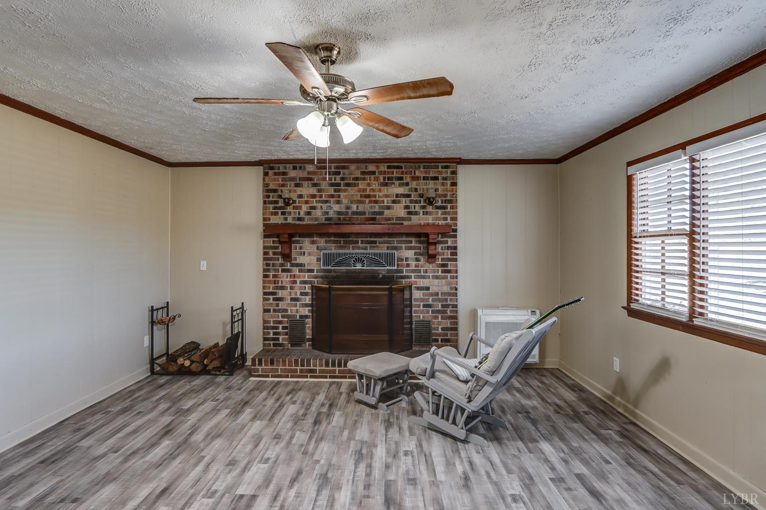 3292 Payneton Road Chatham, VA 24531 - Photo 38 of 48 a living room with furniture and a fireplace