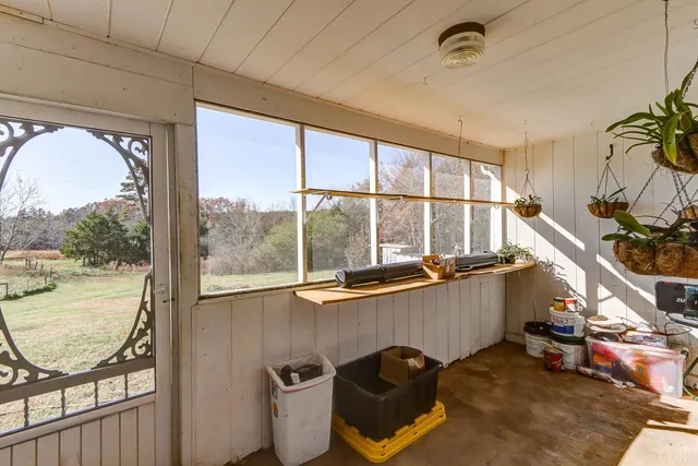 a view of a balcony with chair and table in the balcony