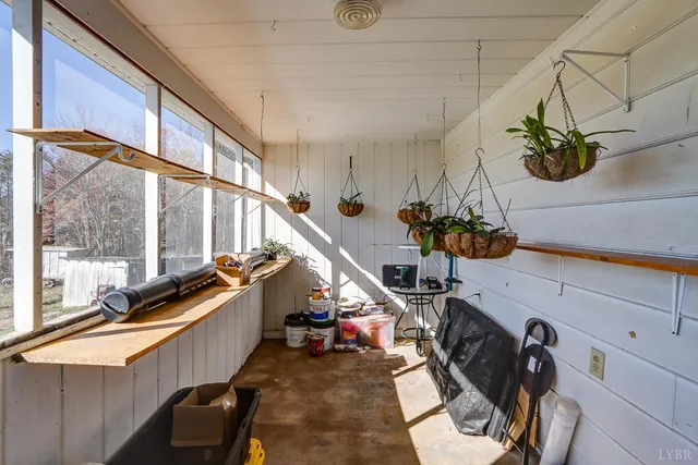 a view of a room with wooden floor and windows