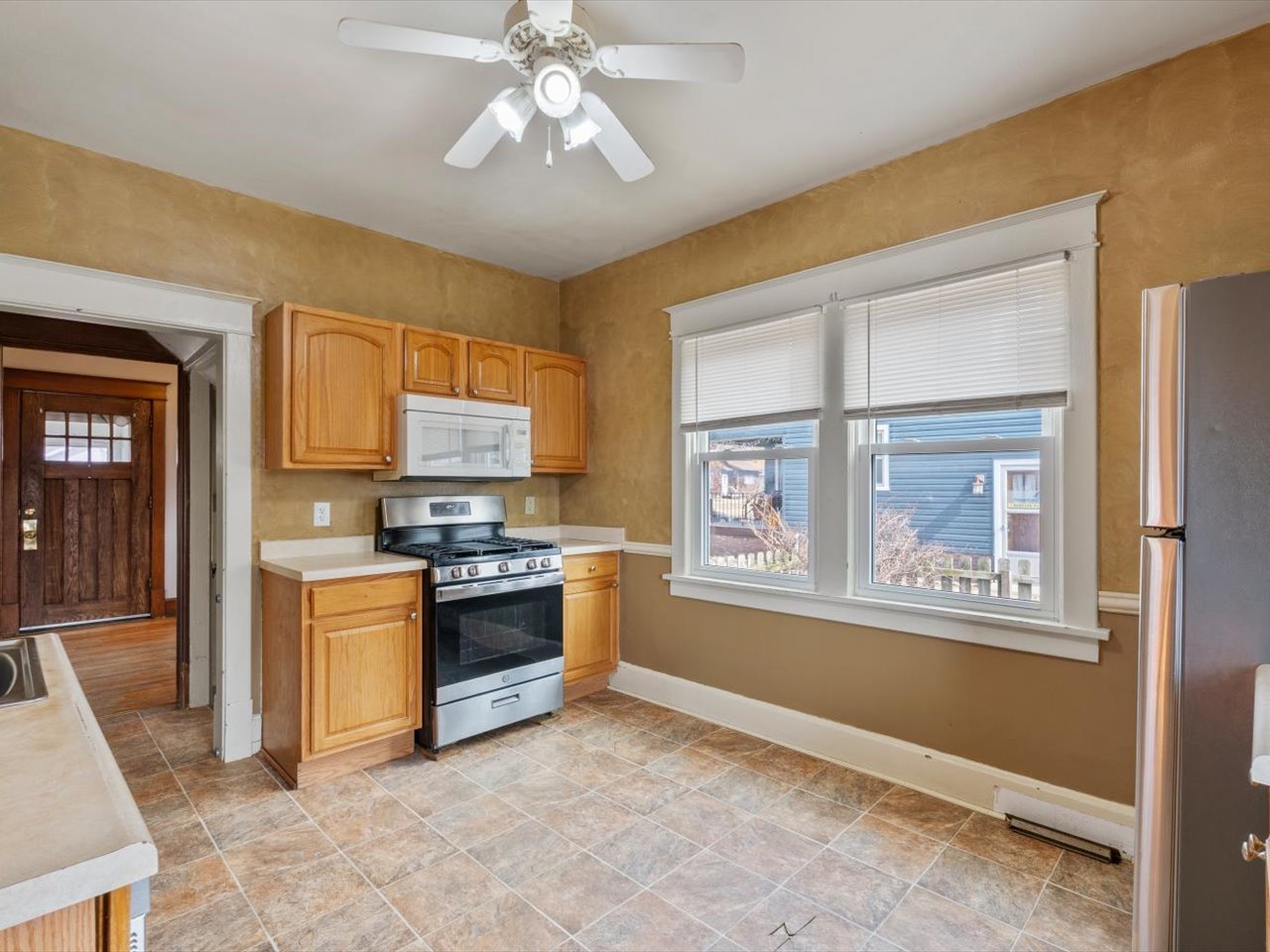 2416 21st Avenue Rock Island, IL 61201 - Photo 19 of 26 a kitchen with stainless steel appliances granite countertop a stove and a refrigerator