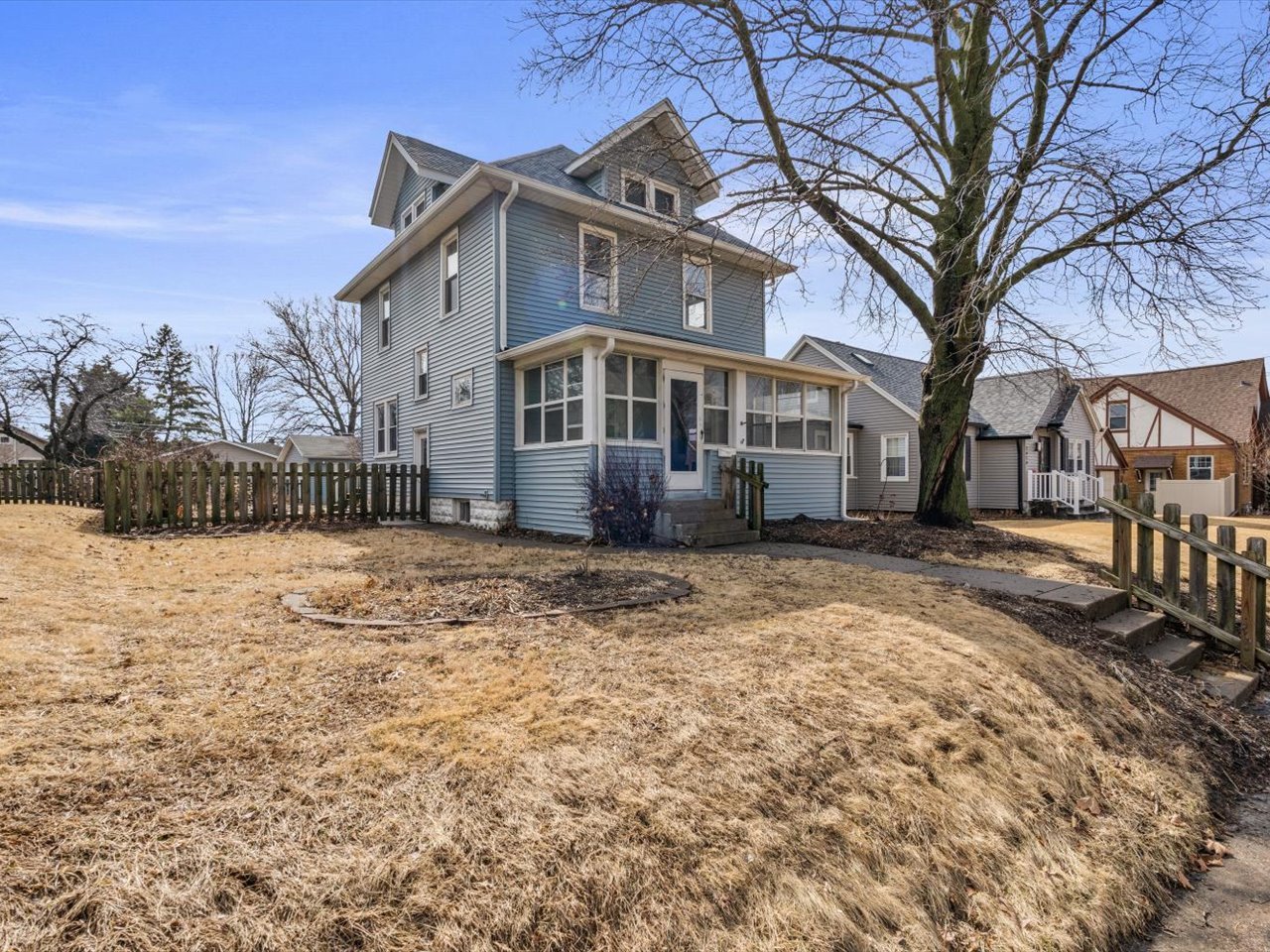 2416 21st Avenue Rock Island, IL 61201 - Photo 2 of 26 a front view of a house with a yard