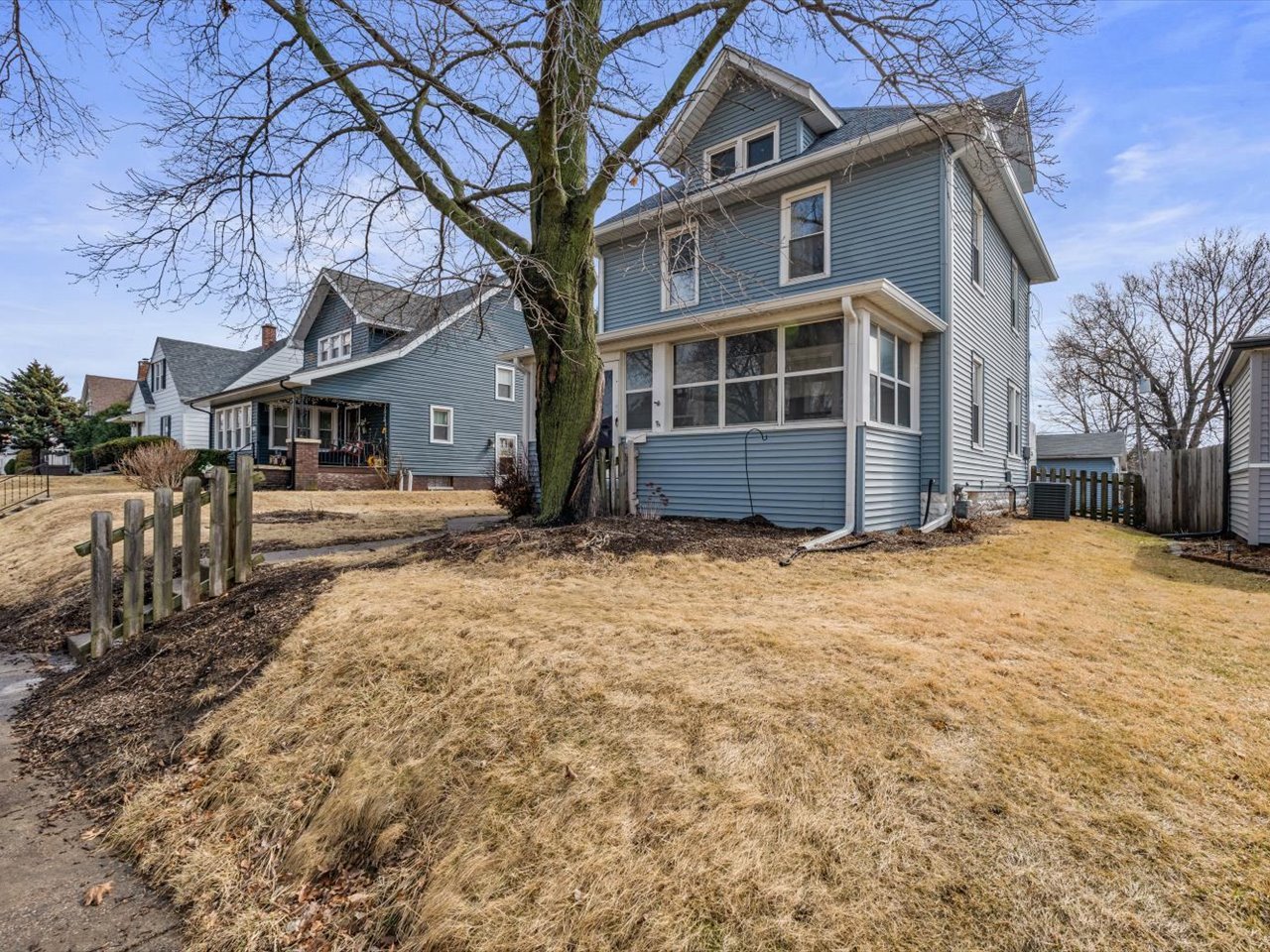 2416 21st Avenue Rock Island, IL 61201 - Photo 3 of 26 a front view of a house with a yard
