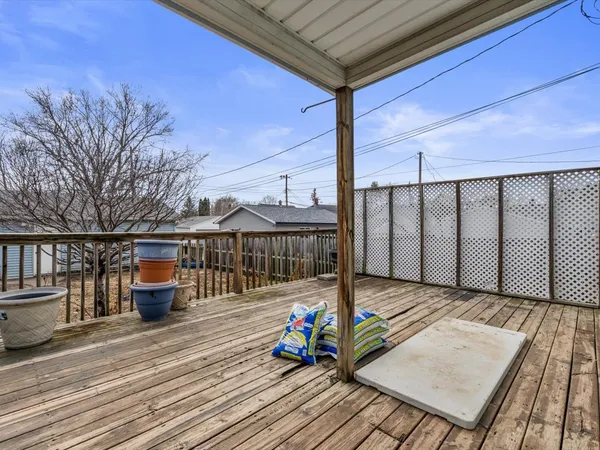 a view of roof deck with wooden floor and barbeque oven