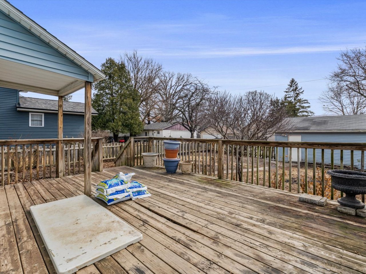 2416 21st Avenue Rock Island, IL 61201 - Photo 9 of 26 a balcony with wooden floor and fence