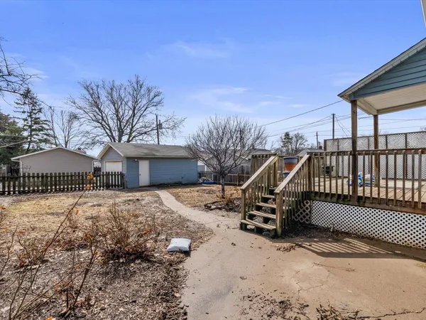 a view of a house with a snow in the yard