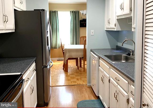 438 Colonial Ridge Lane Arnold, MD 21012 - Photo 17 of 38 Updated Galley-Style Kitchen with Louvered Pantry