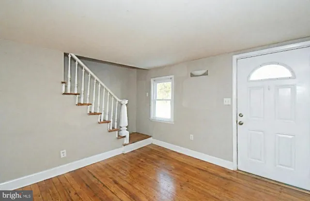 a view of entryway with wooden floor