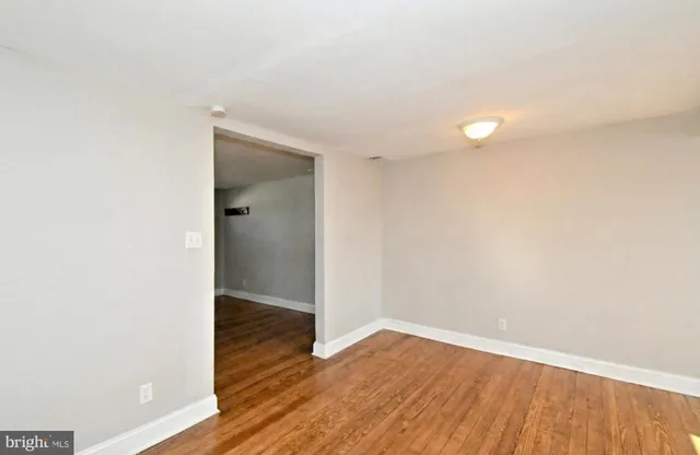 a view of a small space with wooden floor