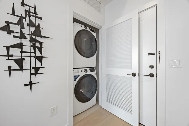 a view of a hallway with washer and dryer