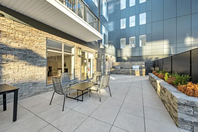 a view of a chairs and table in a patio