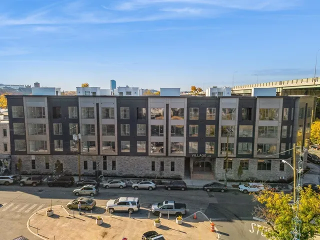 a front view of a building with street view