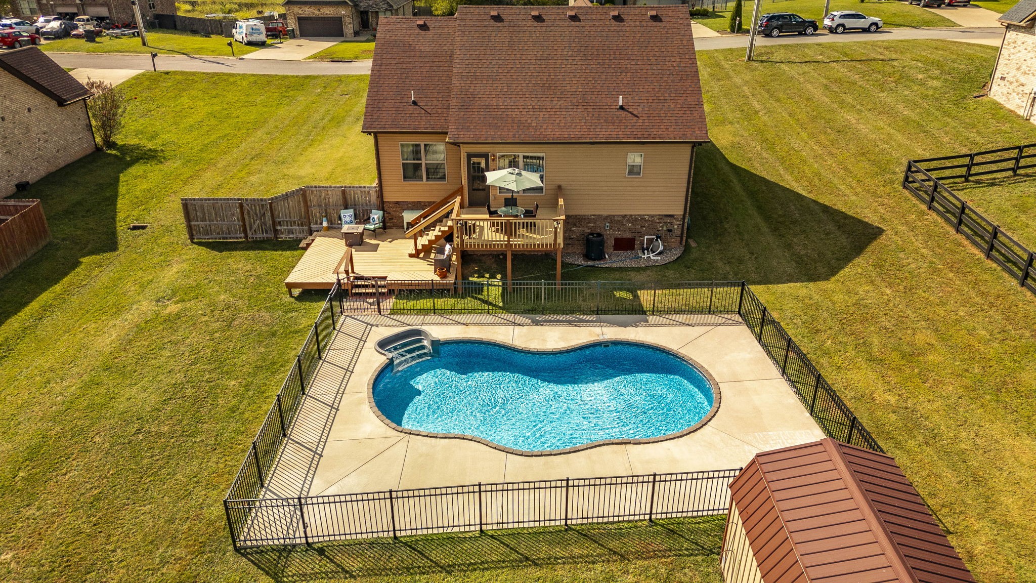 a swimming pool with some tall trees
