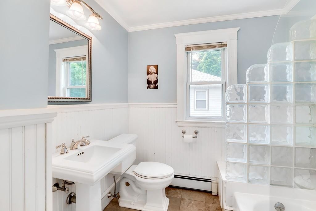 79 Ripley Street, Unit 79 Newton, MA 02459 - Photo 8 of 18 a bathroom with a sink a toilet and a window
