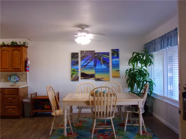a kitchen with a refrigerator and a stove top oven