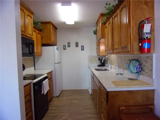 a bedroom with a bed and a lamp on table