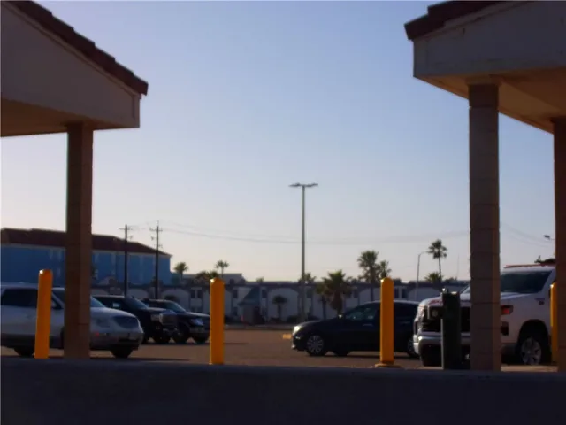 a view of multiple houses with a swimming pool