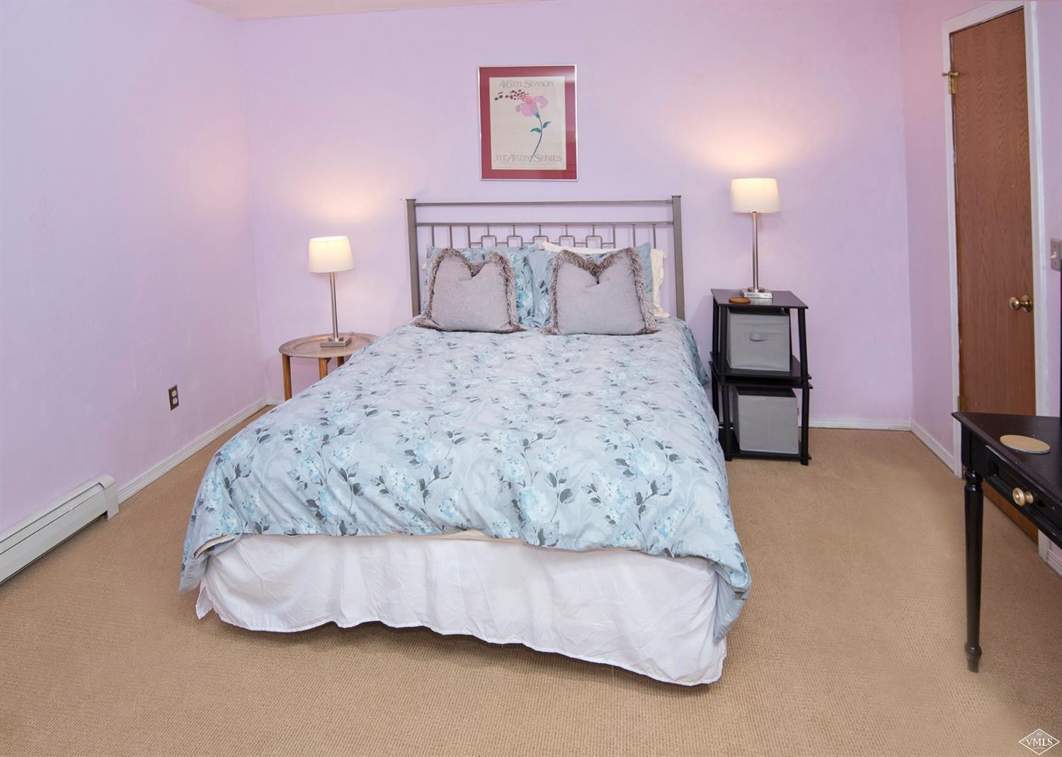 972 Eagle Drive Avon, CO 81620 - Photo 14 of 25 a bedroom with a bed and a chair