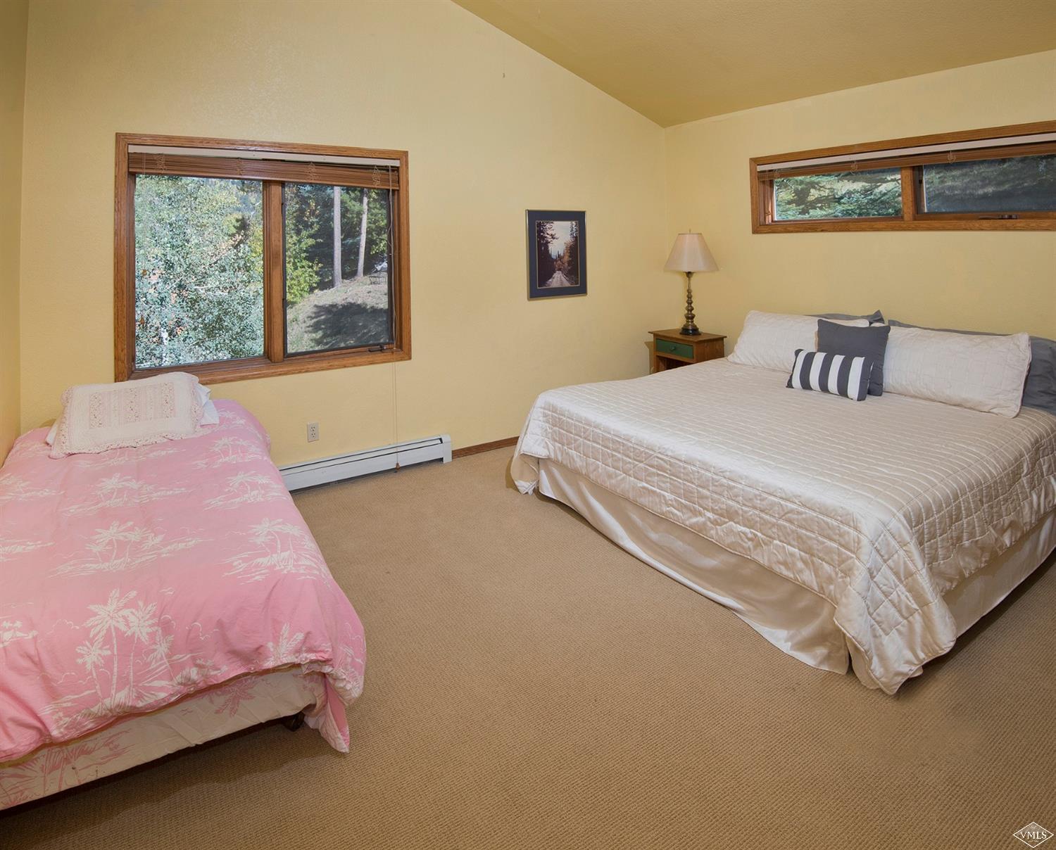 972 Eagle Drive Avon, CO 81620 - Photo 21 of 25 a bedroom with a bed and window