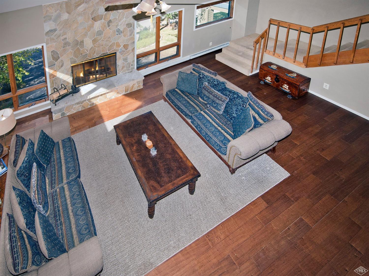 972 Eagle Drive Avon, CO 81620 - Photo 5 of 25 a living room with furniture rug and a fireplace