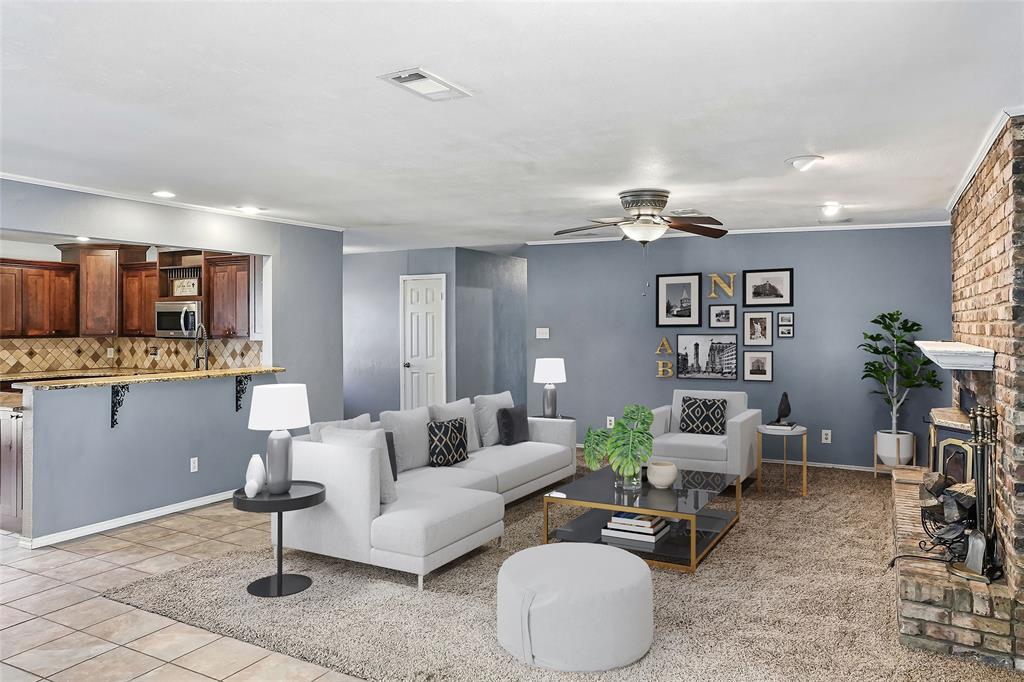 1325 Carter Street Sulphur Springs, TX 75482 - Photo 11 of 31 a living room with furniture and kitchen view
