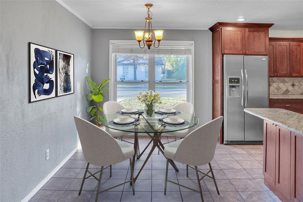 1325 Carter Street Sulphur Springs, TX 75482 - Photo 12 of 31 a view of a dining room with furniture a chandelier and wooden floor