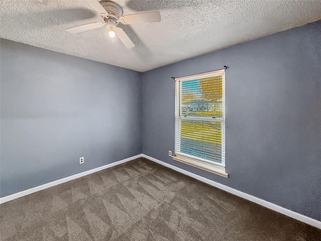 1325 Carter Street Sulphur Springs, TX 75482 - Photo 19 of 31 a view of an empty room with a window