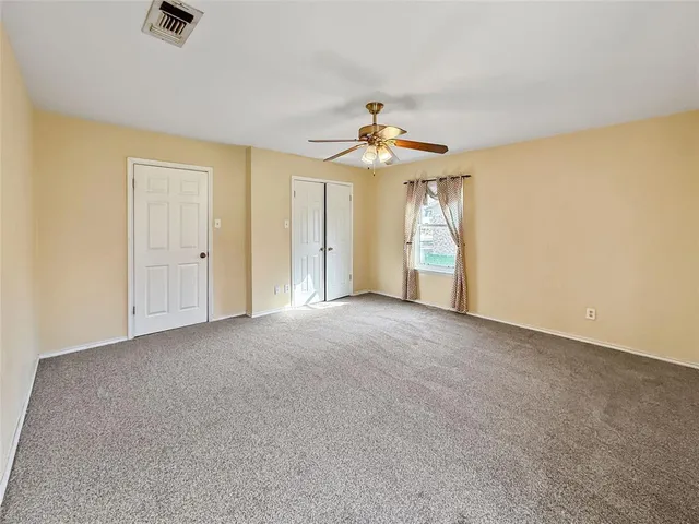 a view of a livingroom with wooden floor and closet
