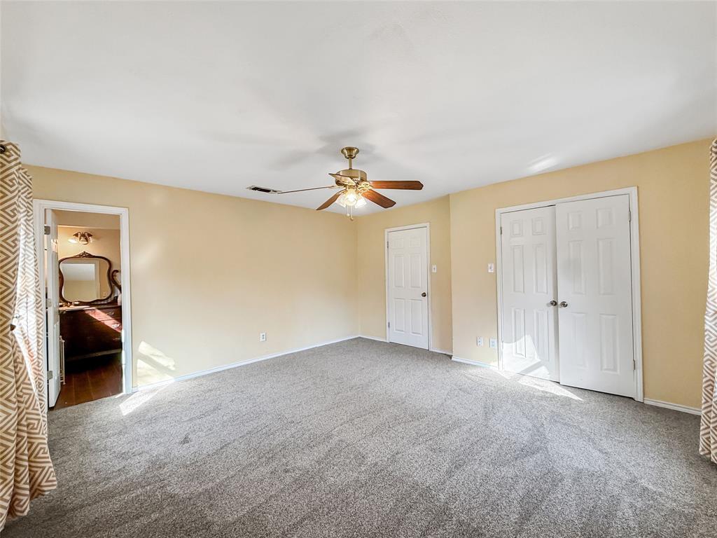 1325 Carter Street Sulphur Springs, TX 75482 - Photo 23 of 31 a view of a livingroom with wooden floor and closet