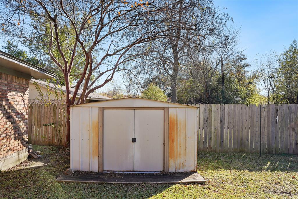1325 Carter Street Sulphur Springs, TX 75482 - Photo 27 of 31 a view of a barn in the middle of a yard