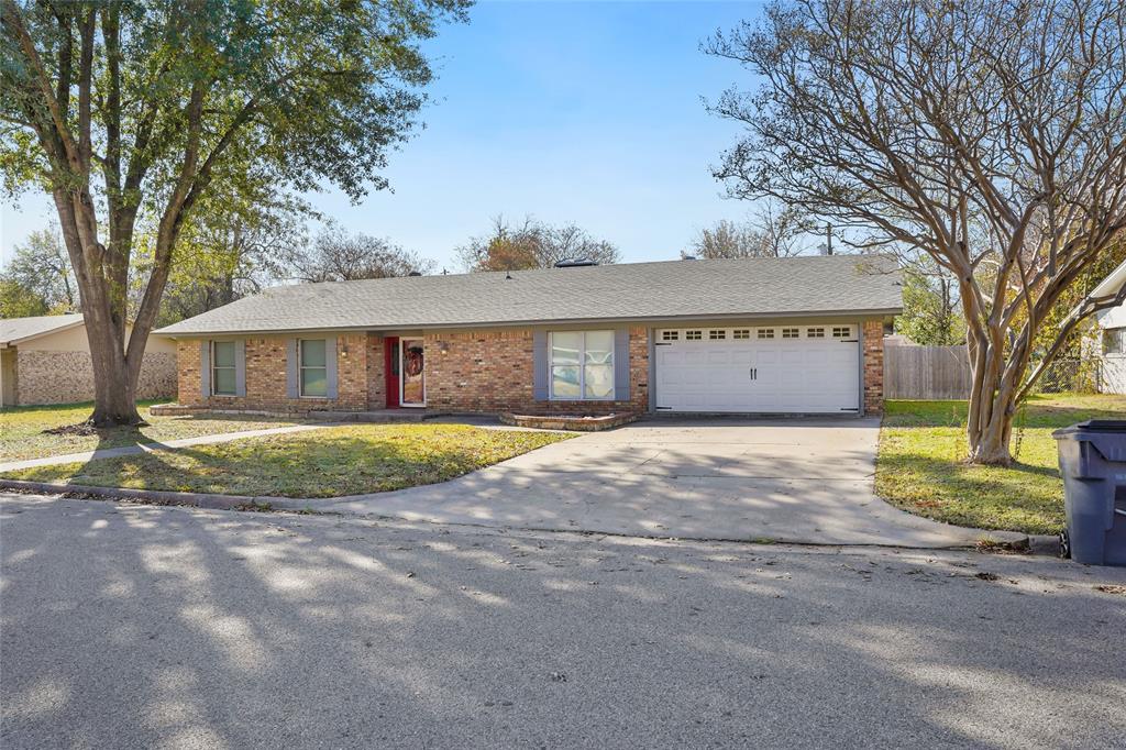 1325 Carter Street Sulphur Springs, TX 75482 - Photo 3 of 31 a view of a house with a backyard and a tree