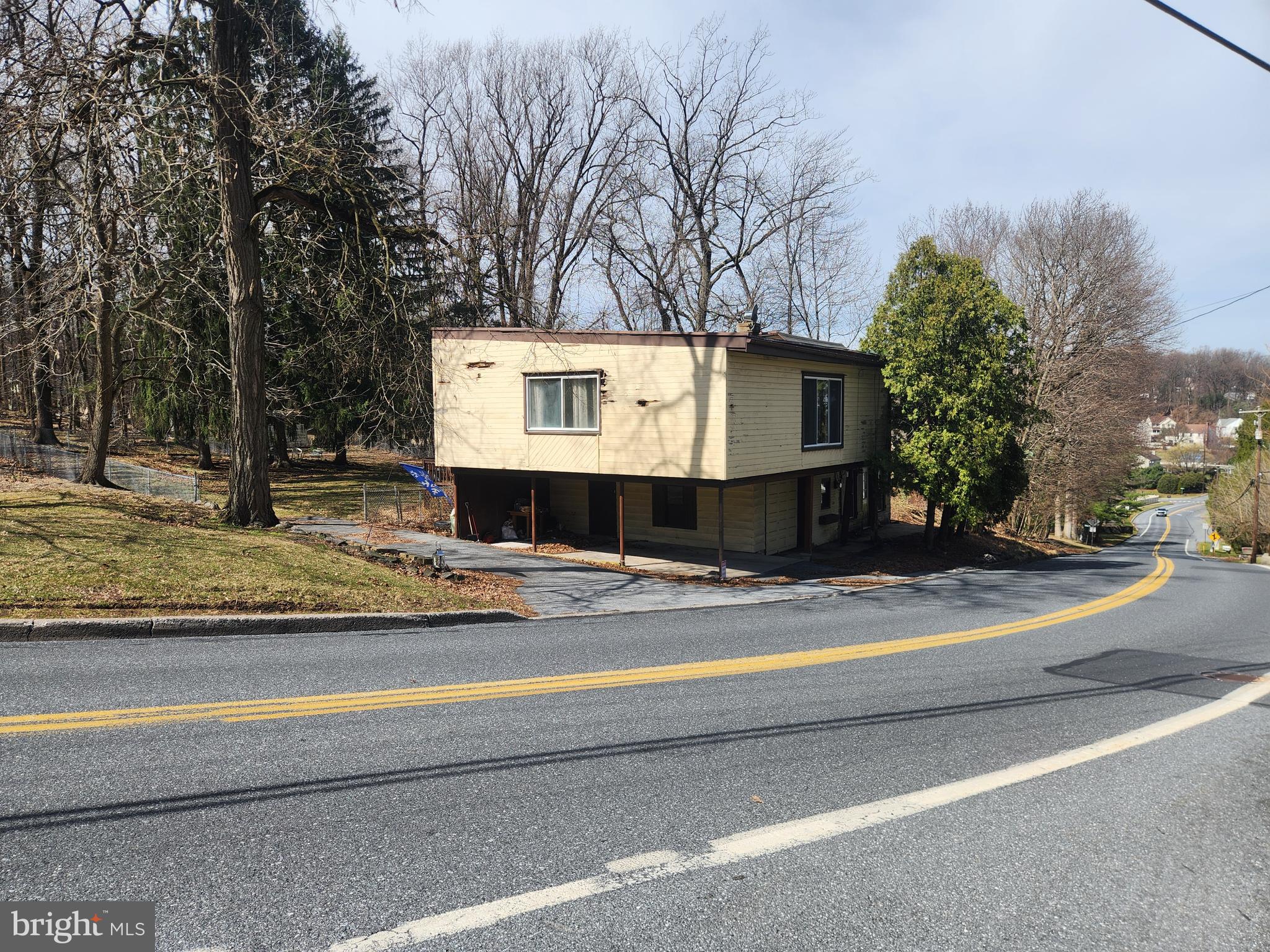 996 Waltonville Road Hummelstown, PA 17036 - Photo 2 of 3 a view of a house with a small yard and large trees