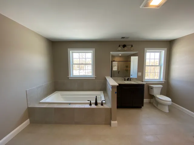 a living room with furniture and windows