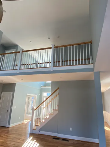 a view of staircase with white walls and a window