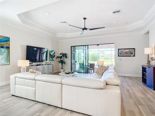 a living room with furniture fireplace and flat screen tv