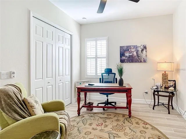a bedroom with double bed and a window
