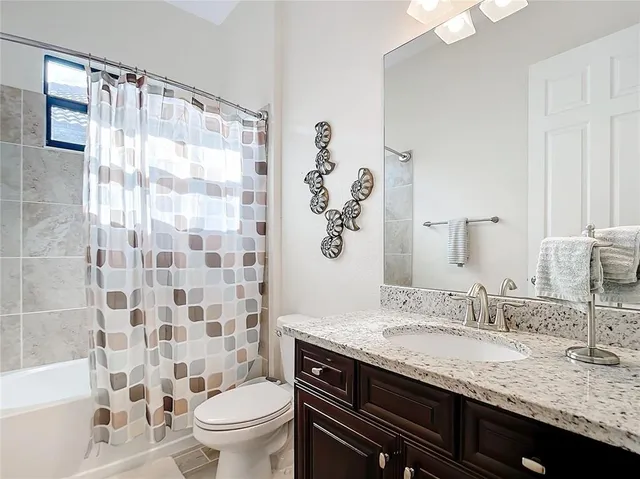 a bedroom with a bed and a table in it