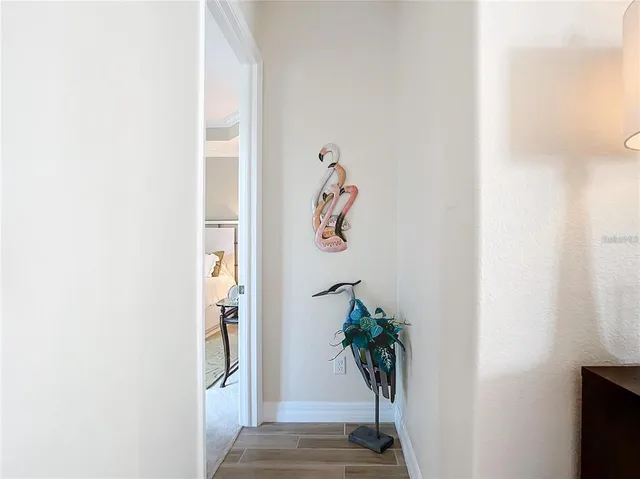 a spacious bathroom with a granite countertop sink and a mirror