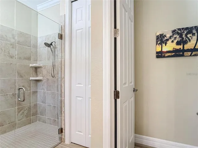 a view of a backyard with table and chairs under an umbrella