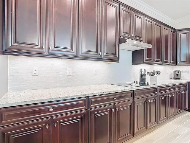 a kitchen with stainless steel appliances granite countertop a sink and cabinets