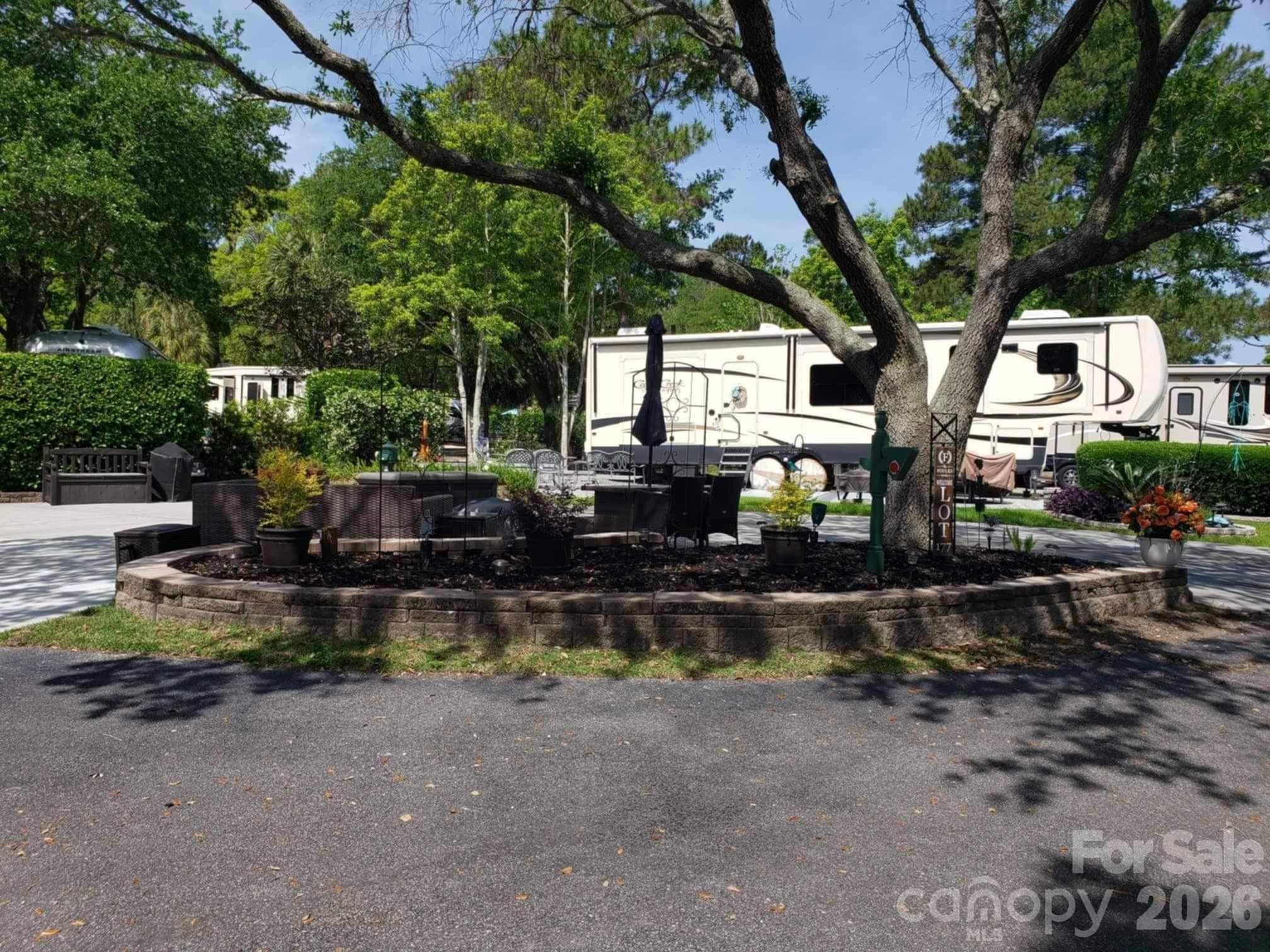 43B Jenkins Island Road, Unit 177 Hilton Head Island, SC 29926 - Photo 6 of 18 a view of backyard with outdoor seating and plants