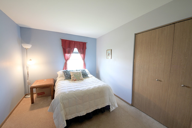 3709 Harms Road Joliet, IL 60435 - Photo 13 of 18 a bedroom with a bed and a window