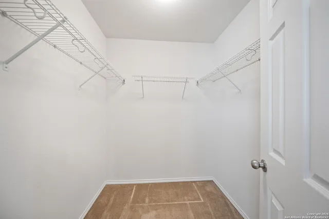 a view of a room with racks on the wall