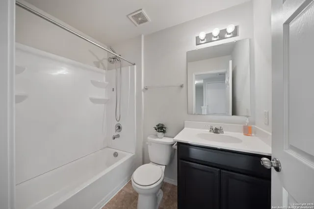 a bathroom with a sink toilet tub and shower