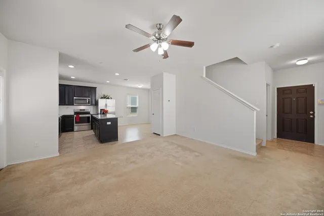 a view of a kitchen with a sink and a stove